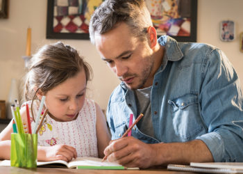 Dad Helping Child with Schoolwork