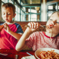 Kids eating Spaghetti
